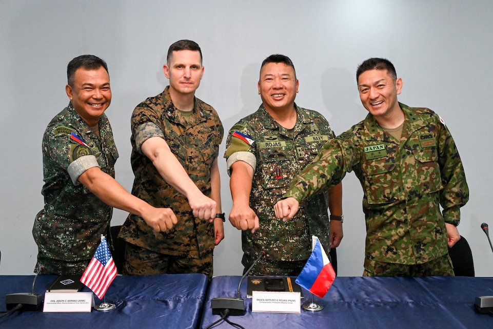 Leaders from the Philippine and U.S. Marine Corps and Japan Ground Self Defense Force pose for a photo during the KAMANDAG 9 opening ceremony at Fort Bonifacio, Manila, Philippines, May 26, 2025.