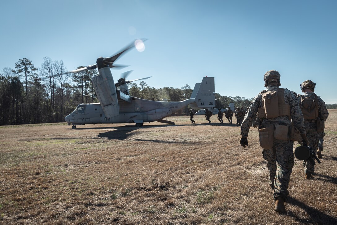 U.S. Marines with Fox Company, 2nd Battalion, 2nd Marine Regiment embark an MV-22 Osprey aircraft with Marine Medium Tiltrotor Squadron 261 (VMM-261) during a raid training exercise at Camp Lejeune, North Carolina, Feb. 14, 2025. As the command element of a Marine Air-Ground Task Force, the 26th Marine Expeditionary Unit completed a certification exercise, conducted by Expeditionary Operations Training Group, to prepare for a diverse range of potential future missions, including personnel recovery, embassy reinforcement, foreign humanitarian assistance, and non-combatant evacuation operations. (U.S. Marine Corps photo by Lance Cpl. Osmar VasquezHernandez.)