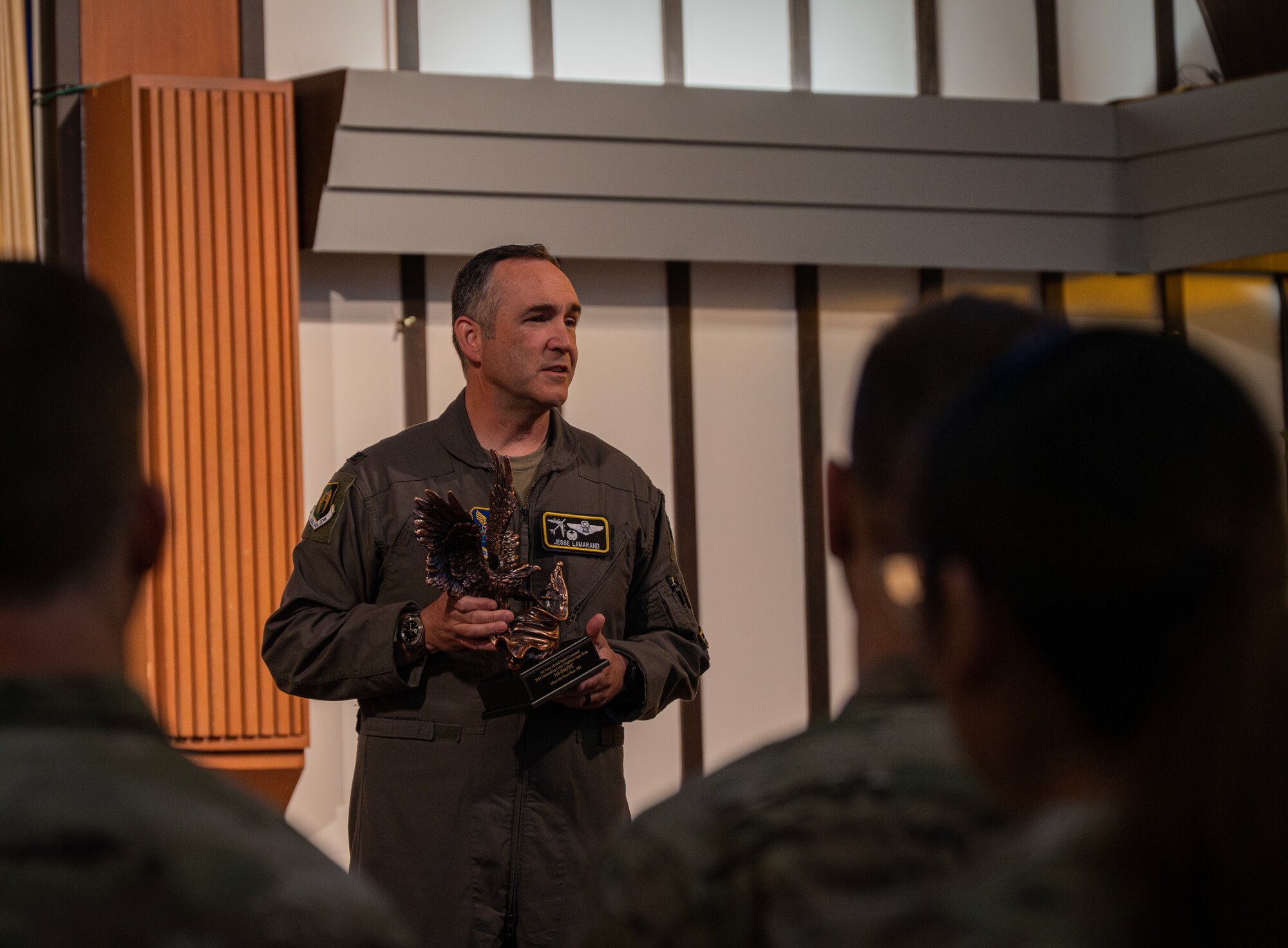 U.S. Air Force Col. Jesse Lamarand, 5th Bomb Wing commander, addresses Team Minot’s chaplains, winners of the Air Force Global Strike Command large team chaplain corps team of the year award at Minot Air Force Base, North Dakota, May 28, 2025. The chaplain corps lines of effort include fortifying warfighter readiness, reimaging chaplain culture and rebuilding chaplain readiness, on which the team award selections are based. (U.S. Air Force photo by Senior Airman Alyssa Bankston)
