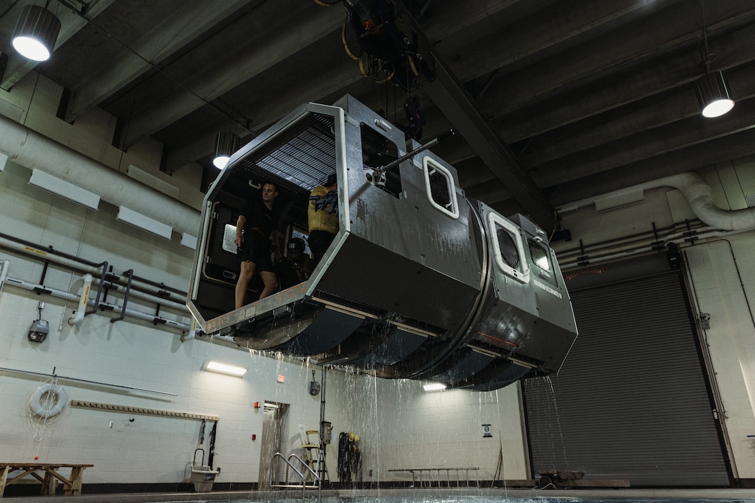 U.S. Marines with the 26th Marine Expeditionary Unit and Special Purpose Marine Air-Ground Task Force – Alert Contingency MAGTF (SPMAGTF-ACM), participate in underwater egress training at Camp Lejeune, North Carolina, March 17, 2025. UET provides Marines and sailors with the 26th MEU SPMAGTF-ACM with opportunities to build the skills and confidence to safely egress from an aircraft or vehicle submerged in water. (U.S. Marine Corps photo by Lance Cpl. Osmar VasquezHernandez)