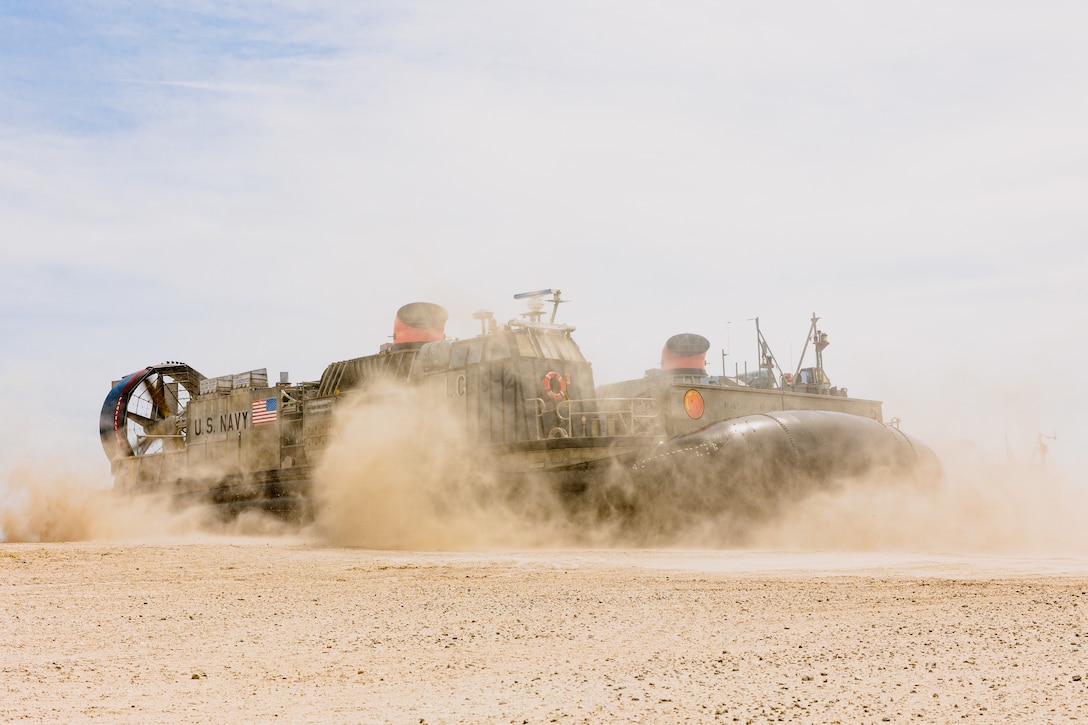 A U.S. Navy landing craft air cushion with Assault Craft Unit Four lands on Onslow Beach at Marine Corps Base Camp Lejeune, North Carolina, as part of Exercise Chesapeake 25, April 27, 2025. Exercise Chesapeake 2025 was a bilateral U.S.–French naval exercise that underscored a commitment to interoperability, maritime readiness, and shared values. The exercise took place as the U.S. Marine Corps is celebrating 250 years of warfighting excellence and reflects the Marine Corps’ commitment to global partnerships and naval integration, enabling the force to rapidly respond to crises, deter adversaries, and reassure allies. (U.S. Marine Corps Photo by Lance Cpl. Jack Labrador)