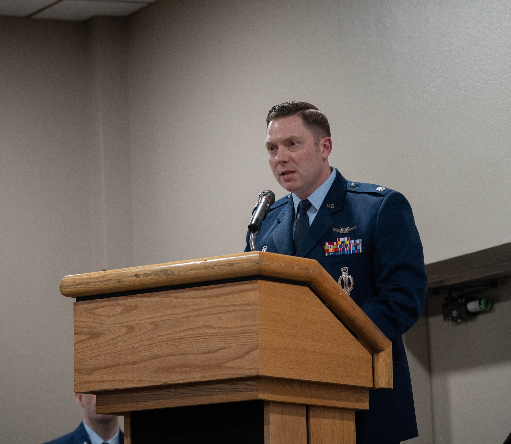 U.S. Air Force Lt. Col. Nicholas Conover, Site Activation Task Force (SATAF) Detachment 12 commander, gives a speech on the newly activated SATAF Detachment 12 at Minot Air Force Base, North Dakota, May 21, 2025. The SATAF Detachments that have been activated are part of a comprehensive modernization program focused on replacing the Minuteman III missiles with new Sentinel missiles. (U.S. Air Force photo by Airman 1st Class Wesley Davies)