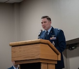 U.S. Air Force Lt. Col. Nicholas Conover, Site Activation Task Force (SATAF) Detachment 12 commander, gives a speech on the newly activated SATAF Detachment 12 at Minot Air Force Base, North Dakota, May 21, 2025. The SATAF Detachments that have been activated are part of a comprehensive modernization program focused on replacing the Minuteman III missiles with new Sentinel missiles. (U.S. Air Force photo by Airman 1st Class Wesley Davies)
