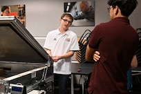 Seniors from George Mason University visited Naval Surface Warfare Center, Carderock Division, to present their senior design projects to Carderock engineers on May 9, 2024. The two teams presented their projects; one team built an environmental chamber for mechanical testing and the other was tasked with fabricating composite panels for ready service lockers that were malleable enough to bend 45 degrees on all four corners and edges. Carderock, the Navy's ship design and innovation powerhouse, provides the technical foundation for the future fleet through world-class research, development, and testing. (U.S. Navy Photo by Chalene Simmons)