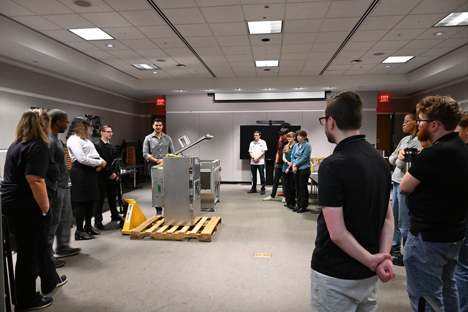 Seniors from George Mason University visited Naval Surface Warfare Center, Carderock Division, to present their senior design projects to Carderock engineers on May 9, 2024. The two teams presented their projects; one team built an environmental chamber for mechanical testing and the other was tasked with fabricating composite panels for ready service lockers that were malleable enough to bend 45 degrees on all four corners and edges. Carderock, the Navy's ship design and innovation powerhouse, provides the technical foundation for the future fleet through world-class research, development, and testing. (U.S. Navy Photo by Chalene Simmons)