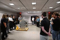 Seniors from George Mason University visited Naval Surface Warfare Center, Carderock Division, to present their senior design projects to Carderock engineers on May 9, 2024. The two teams presented their projects; one team built an environmental chamber for mechanical testing and the other was tasked with fabricating composite panels for ready service lockers that were malleable enough to bend 45 degrees on all four corners and edges. Carderock, the Navy's ship design and innovation powerhouse, provides the technical foundation for the future fleet through world-class research, development, and testing. (U.S. Navy Photo by Chalene Simmons)