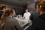 Seniors from George Mason University visited Naval Surface Warfare Center, Carderock Division, to present their senior design projects to Carderock engineers on May 9, 2024. The two teams presented their projects; one team built an environmental chamber for mechanical testing and the other was tasked with fabricating composite panels for ready service lockers that were malleable enough to bend 45 degrees on all four corners and edges. Carderock, the Navy's ship design and innovation powerhouse, provides the technical foundation for the future fleet through world-class research, development, and testing