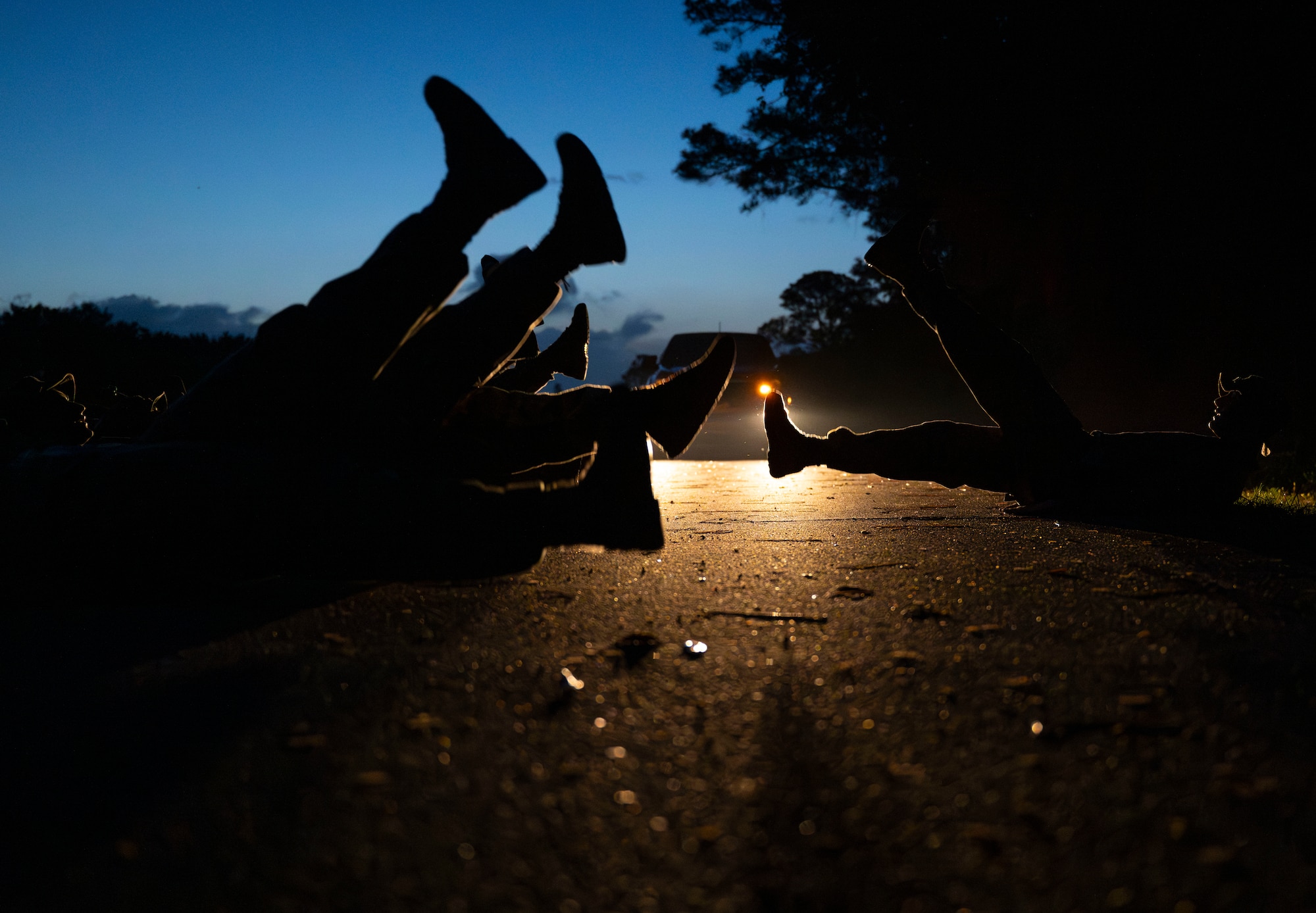 U.S. Marines and an Airman perform flutter kicks during Corporals Course.