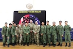 Group photo for the Information Operations Subject Matter Exchange during the opening ceremony of Tiger Balm 2025 on May 5 2025 at Mandai Hill, Singapore.