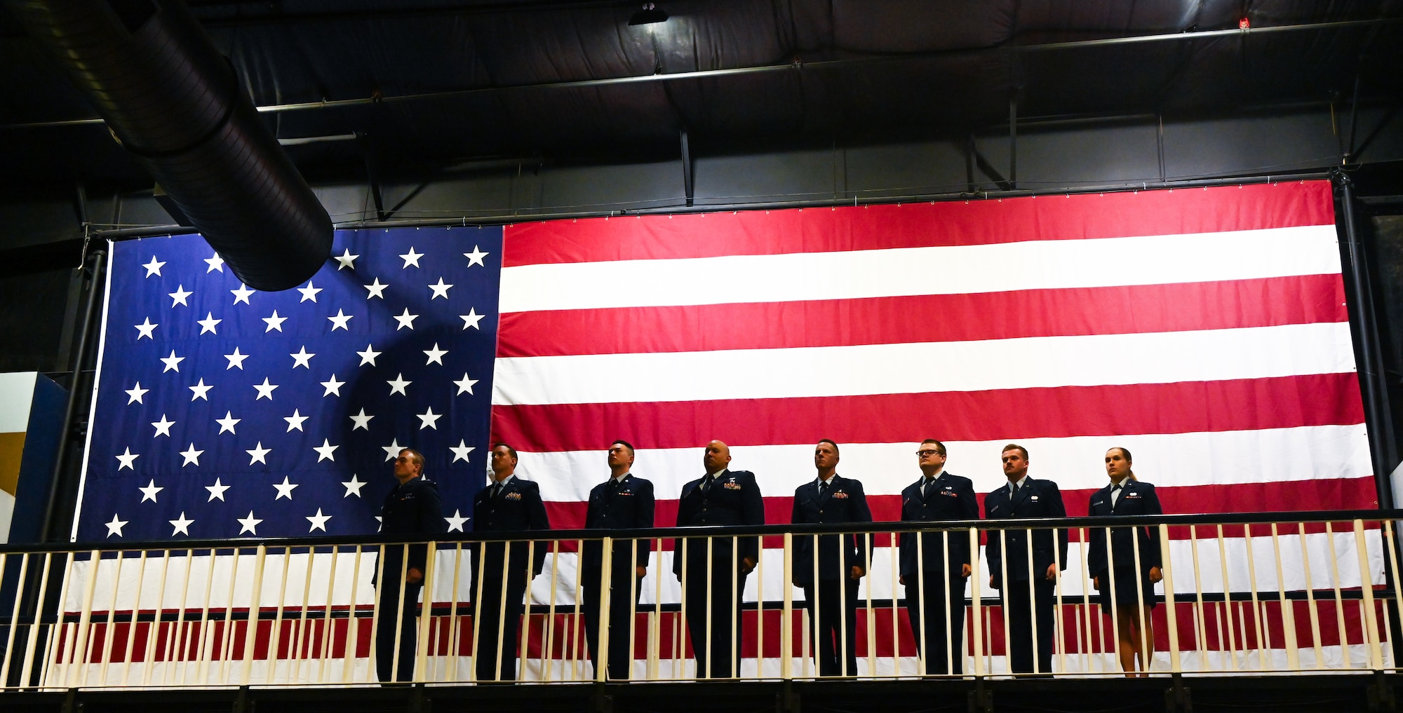 Airmen assigned to the 16th Electronic Warfare Squadron stand at attention during the 16 EWS change of command at Eglin Air Force Base, Fla., May 28, 2025. The 16 EWS provides electromagnetic warfare support for U.S. Air Force Global Strike platforms and systems. (U.S. Air Force photo by Capt. Benjamin Aronson)