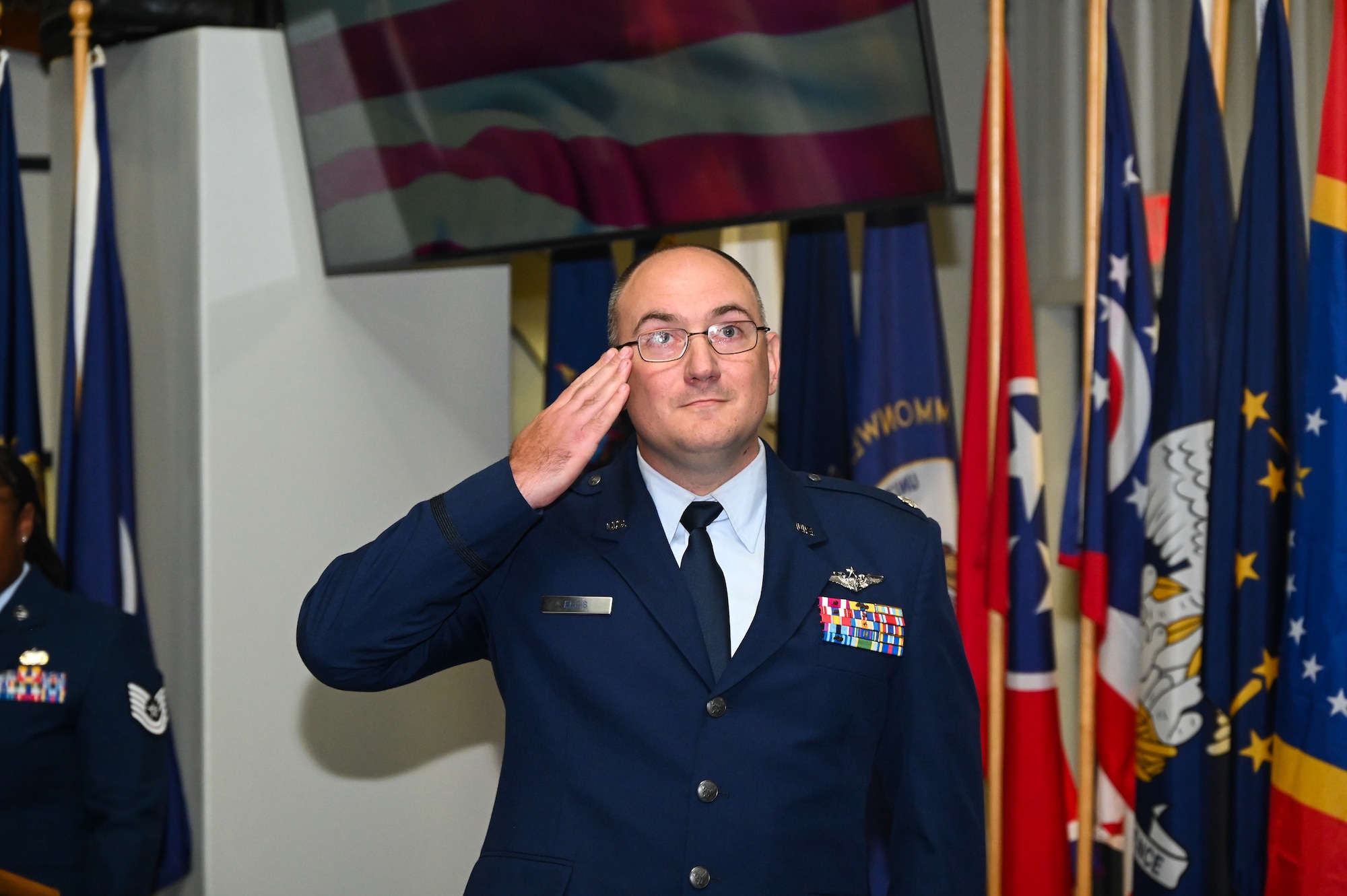 U.S. Air Force Lt. Col. Joseph Ellis, 16th Electronic Warfare Squadron commander, gives his first salute to members of the 16 EWS after taking command during a change of command ceremony at Eglin Air Force Base, Fla., May 28, 2025. The 16 EWS provides electromagnetic warfare support for U.S. Air Force Global Strike platforms and systems. (U.S. Air Force photo by Capt. Benjamin Aronson)