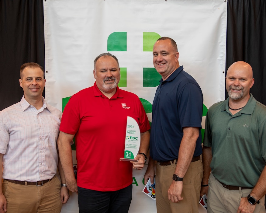 U.S. Army Corps of Engineers, Omaha District representatives (from left) Jeremy Szynskie, Jeremy Ayala, Todd Tobias and Nate Tillquist pose for a photo with the Omaha District’s award, May 14, 2025, at the National Safety Council, Nebraska Chapter safety awards celebration in LaVista, Nebraska.