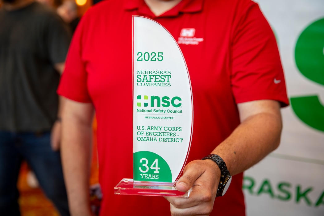 U.S. Army Corps of Engineers, Omaha District’s Jeremy Ayala, Rapid Response Technical Center of Expertise contracting officer representative, holds an award May 14, 2025, at the National Safety Council, Nebraska Chapter safety awards celebration in LaVista, Nebraska.