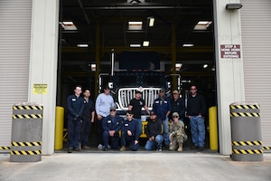 30th Logistic Readiness Squadron members pose for a group photo with the newly arrived Payload transporter Replacement (PTR) at Vandenberg Space Force Base.