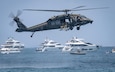 A U.S. Army UH-60L Black Hawk helicopter with the 8-229th Assault Helicopter Battalion, U.S. Army Reserve Aviation Command, flies just feet above the Atlantic Ocean to drop Soldiers from the 7th Special Forces Group (Airborne) during a beach assault demonstration at the Hyundai Air & Sea Show in Miami Beach, Florida, over Memorial Day weekend, May 24–25, 2025. Army Aviation provides critical air mobility and firepower, enabling rapid deployment and support for ground forces in diverse operational environments. (Photo by Matt Haskell)