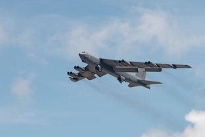 A very large military aircraft soars overhead