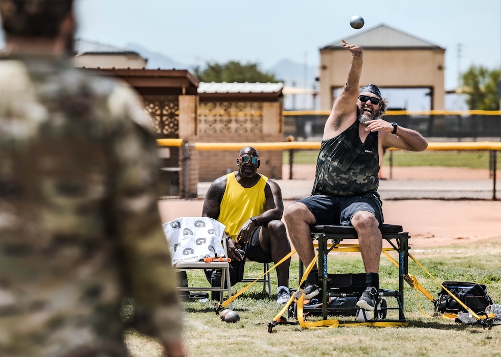 Para-athlete Jesus Ontiveros tosses a medicine ball during Paralympics Training Camp