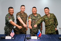 Leaders from the Philippine and U.S. Marine Corps and Japan Ground Self Defense Force pose for a photo during the KAMANDAG 9 opening ceremony at Fort Bonifacio, Manila, Philippines, May 26, 2025.