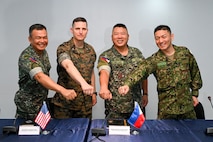 Leaders from the Philippine and U.S. Marine Corps and Japan Ground Self Defense Force pose for a photo during the KAMANDAG 9 opening ceremony at Fort Bonifacio, Manila, Philippines, May 26, 2025.