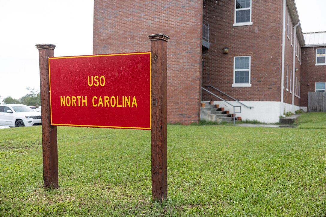 A sign stands in front of the USO of North Carolina on Marine Corps Base Camp Lejeune, May 14, 2025. Since relocating to its new base location, the USO has seen foot traffic increase to over 36,000 service members and families in 2024. (U.S. Marine Corps photo by Cpl. Loriann Dauscher)