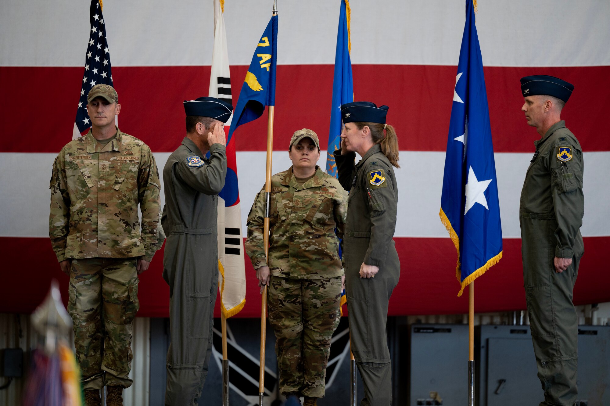 U.S. Air Force Col. Kathryn Gaetke renders a salute as she accepts command of the 8th Fighter Wing from U.S. Air Force Lt. Gen. David Iverson during a change of command ceremony at Kunsan Air Base, Republic of Korea, May 30, 2025.