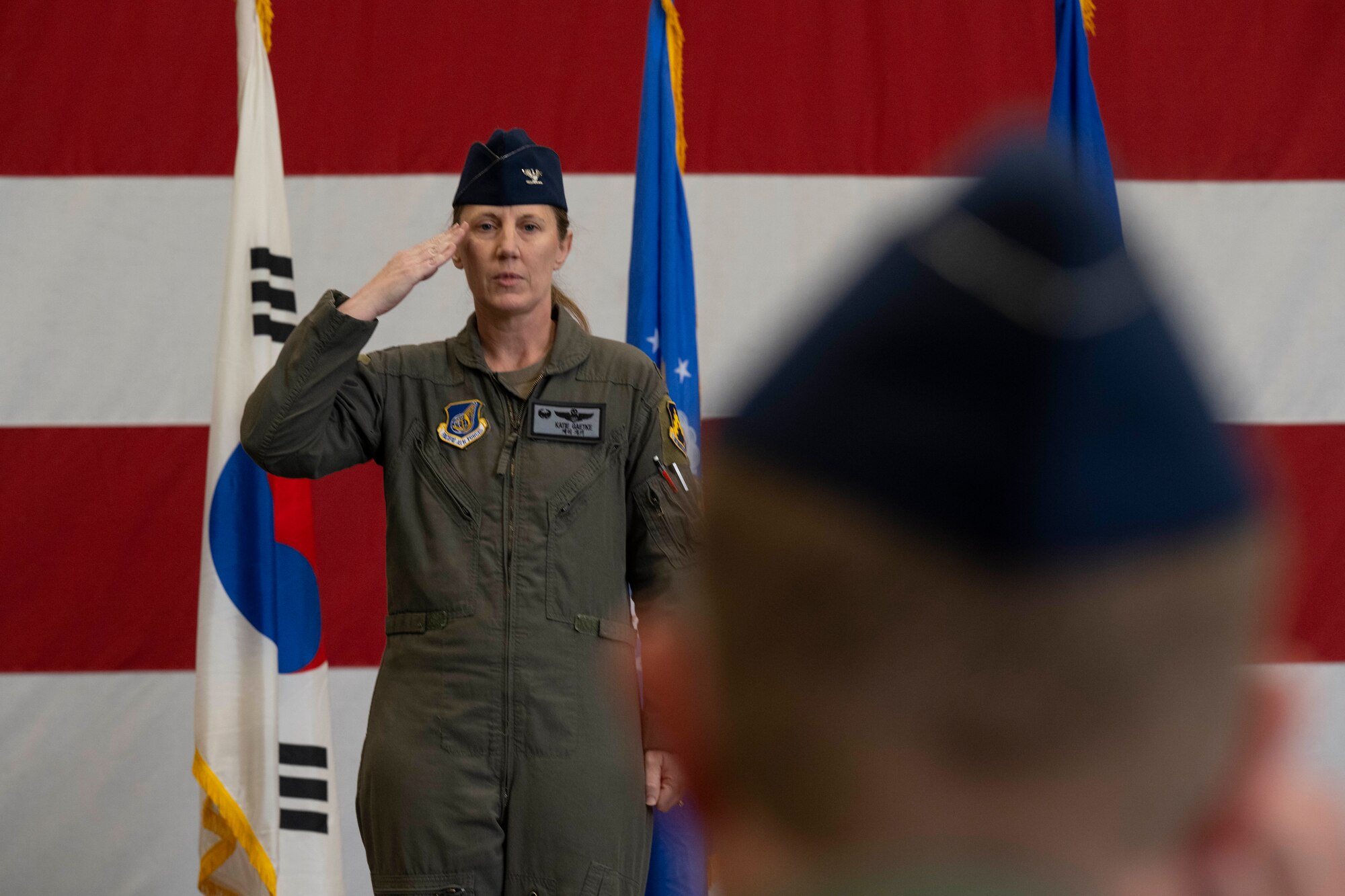 U.S. Air Force Col. Kathryn Gaetke renders her first salute as the 8th Fighter Wing commander to Col. Christopher Mulder, 8th FW deputy commander, during the 8th FW change of command ceremony at Kunsan Air Base, Republic of Korea, May 30, 2025.