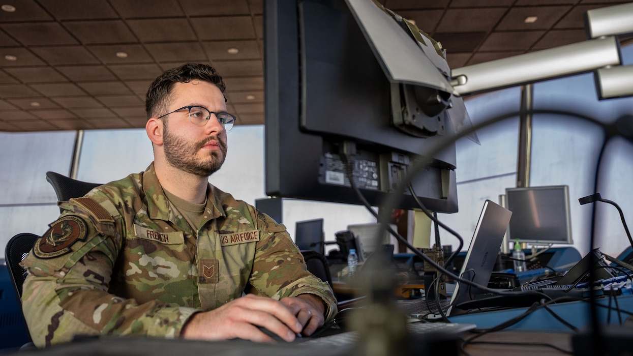 A man works on a computer.