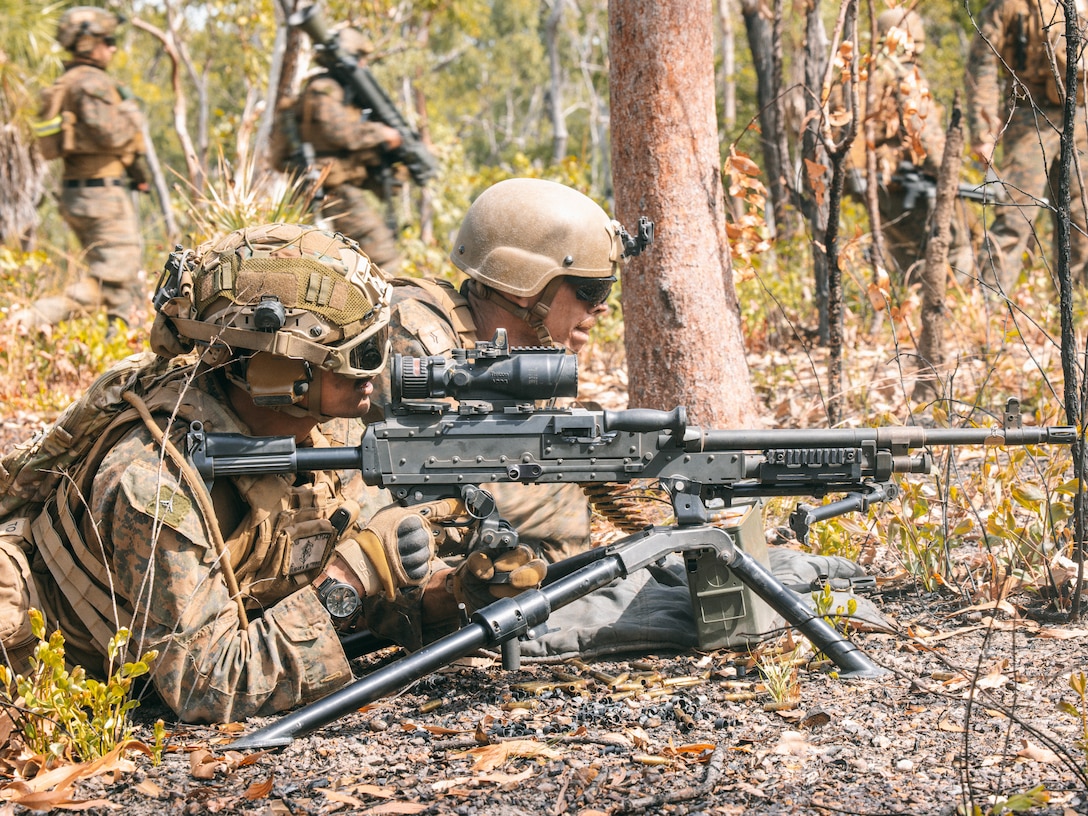 U.S. Marine Corps Lance Cpl. Ace Languban (left), and Lance Cpl. Cole Mountz, both machine gunners with 2nd Battalion, 1st Marine Regiment, Marine Rotational Force – Darwin 25.3, set up an M240B medium machine gun during a squad attack range as part of Predator’s Walk at Mount Bundey Training Area, Northern Territory, Australia, May 23, 2025. The Predator Series consists of two bilateral exercises between MRF-D and the Australian Defence Force, Predator’s Walk and Predator’s Run, designed to further enhance small unit interoperability and combined arms capabilities in a realistic training environment. Languban is a native of California and Mountz is a native of Texas. (U.S. Marine Corps photo by Sgt. Ezekieljay Correa)