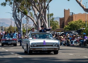 U.S. Space Force Col. Mark Shoemaker, Space Launch Delta 30 commander, and his wife Mary, wave to the crowd at the Santa Maria Elks Rodeo Parade in Santa Maria, Calif., May 31, 2025. VSFB leadership showed support for the surrounding community by participating in events through the weekend, commemorating 82 years of the Elks Rodeo. (U.S. Space Force photo by Senior Airman Ryan Quijas)