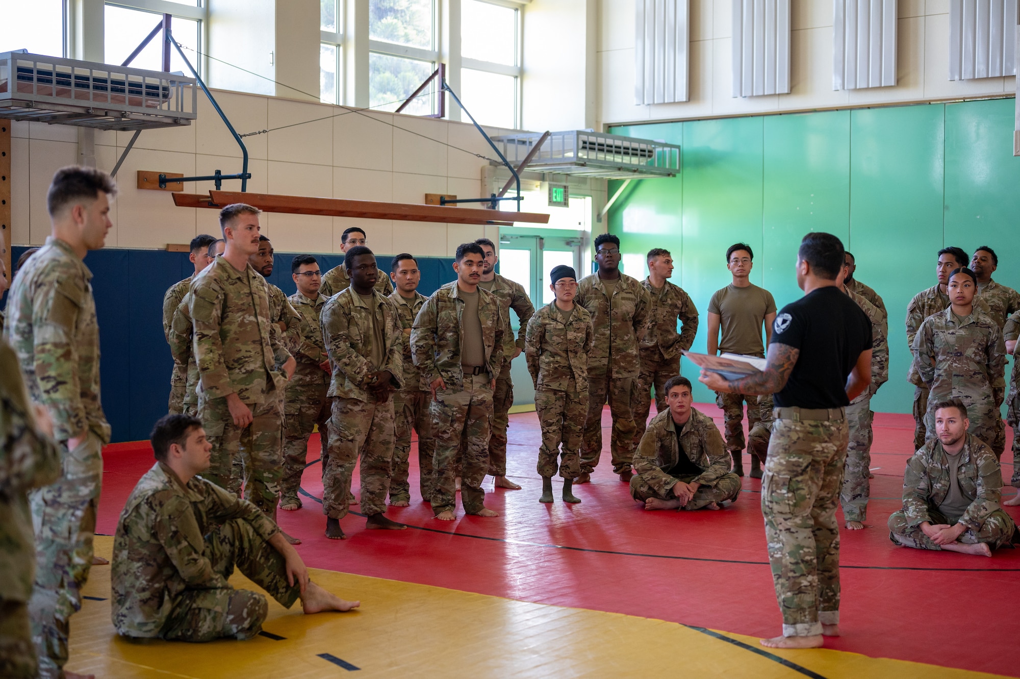 instructor gives information to students during combatives course