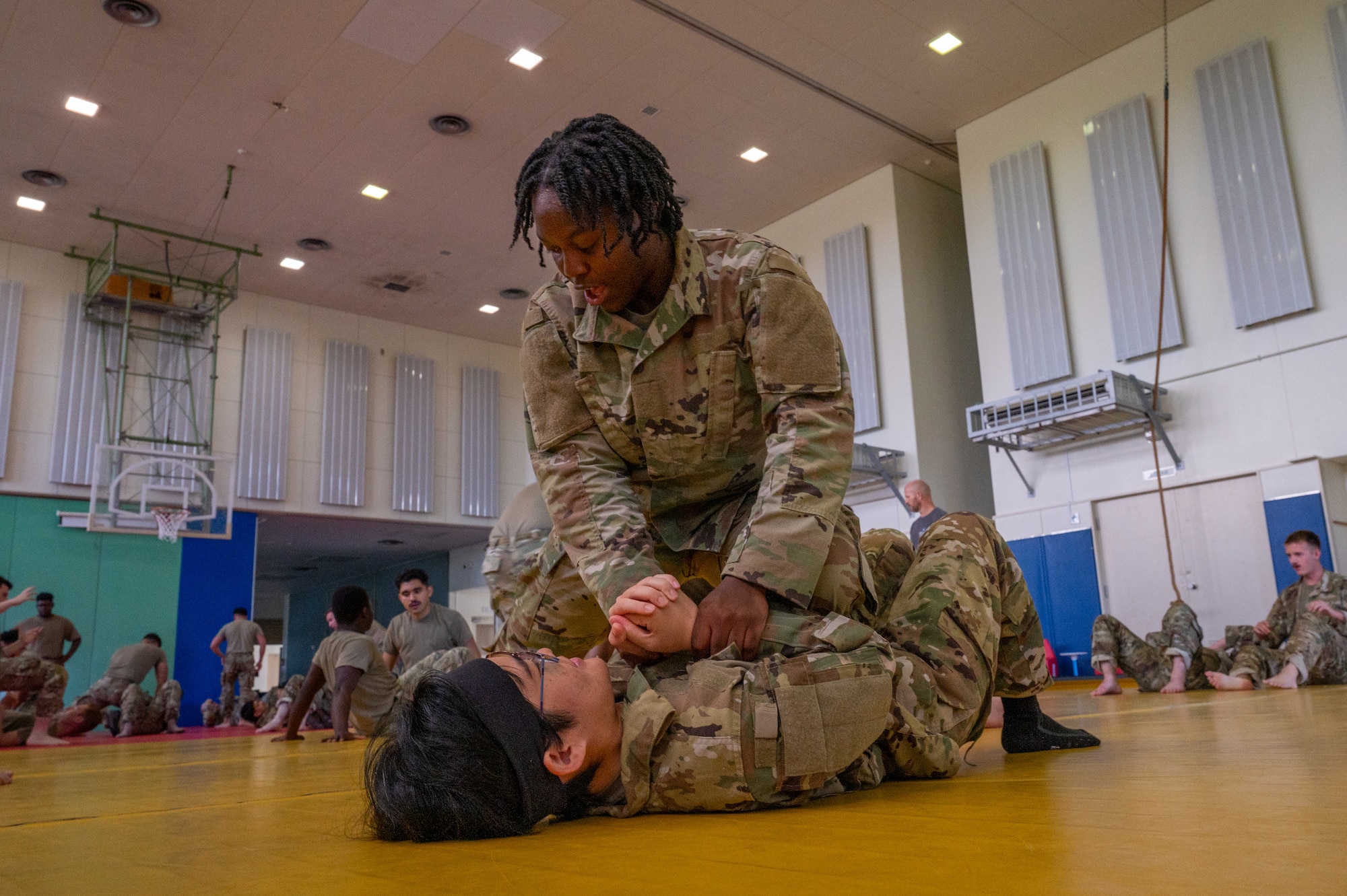combatives students practice moves with one another