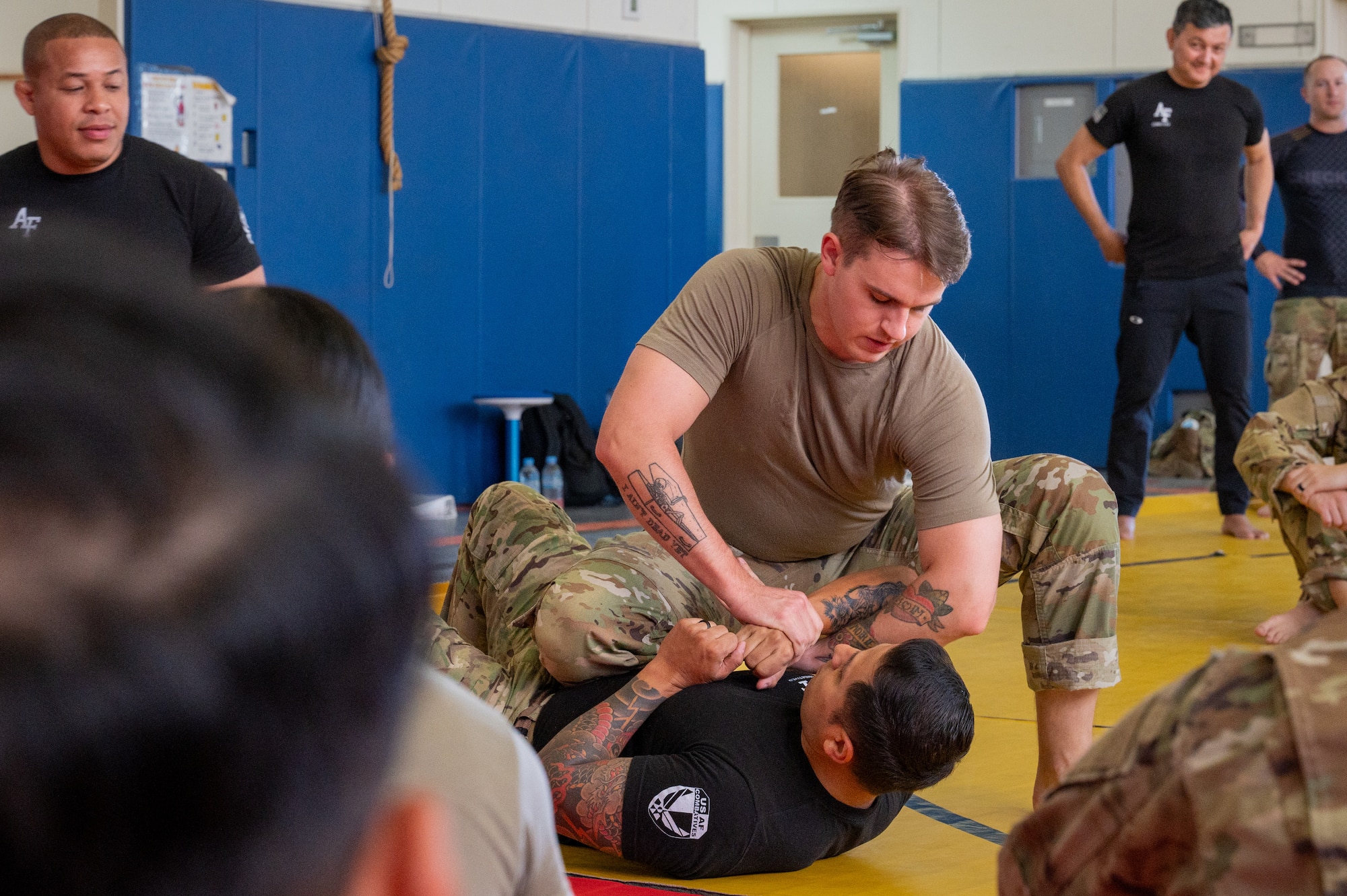 combatives instructors give demonstration to students