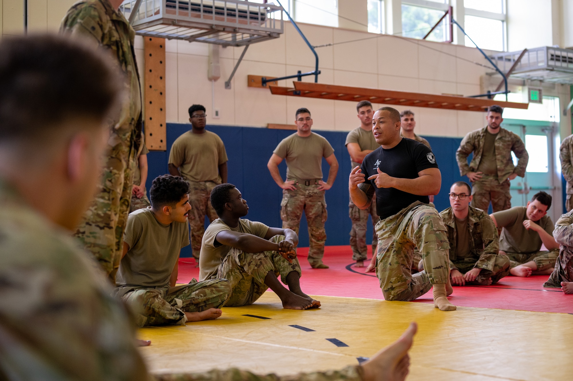 combatives participants listen to instructor give directions