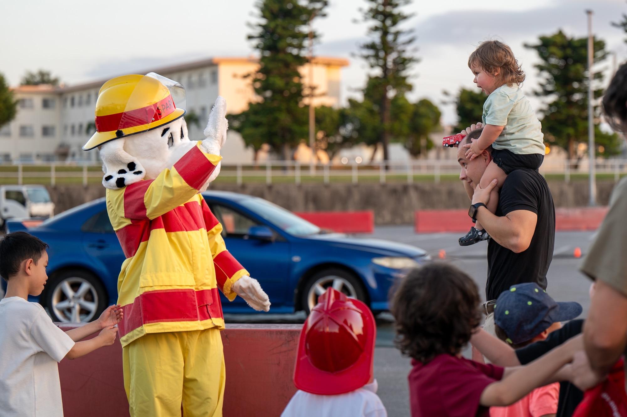 Sparky greets attendees of a fire and vehicle extrication demonstration.
