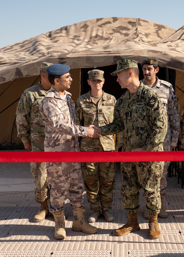 AL UDEID AIR BASE, Qatar (Nov. 3, 2025) Adm. Brad Cooper, commander of U.S. Central Command, right, shakes hands with Chief of Staff of Qatar Armed Forces Lt. Gen. Jassim Al-Mannai during a ribbon-cutting ceremony at Al Udeid Air Base, Nov. 3. The event marked the opening of a new Combined Command Post for air defense staffed by personnel from Qatar and U.S. forces. (U.S. Air Force photo by Tech. Sgt. Chris Thornbury)