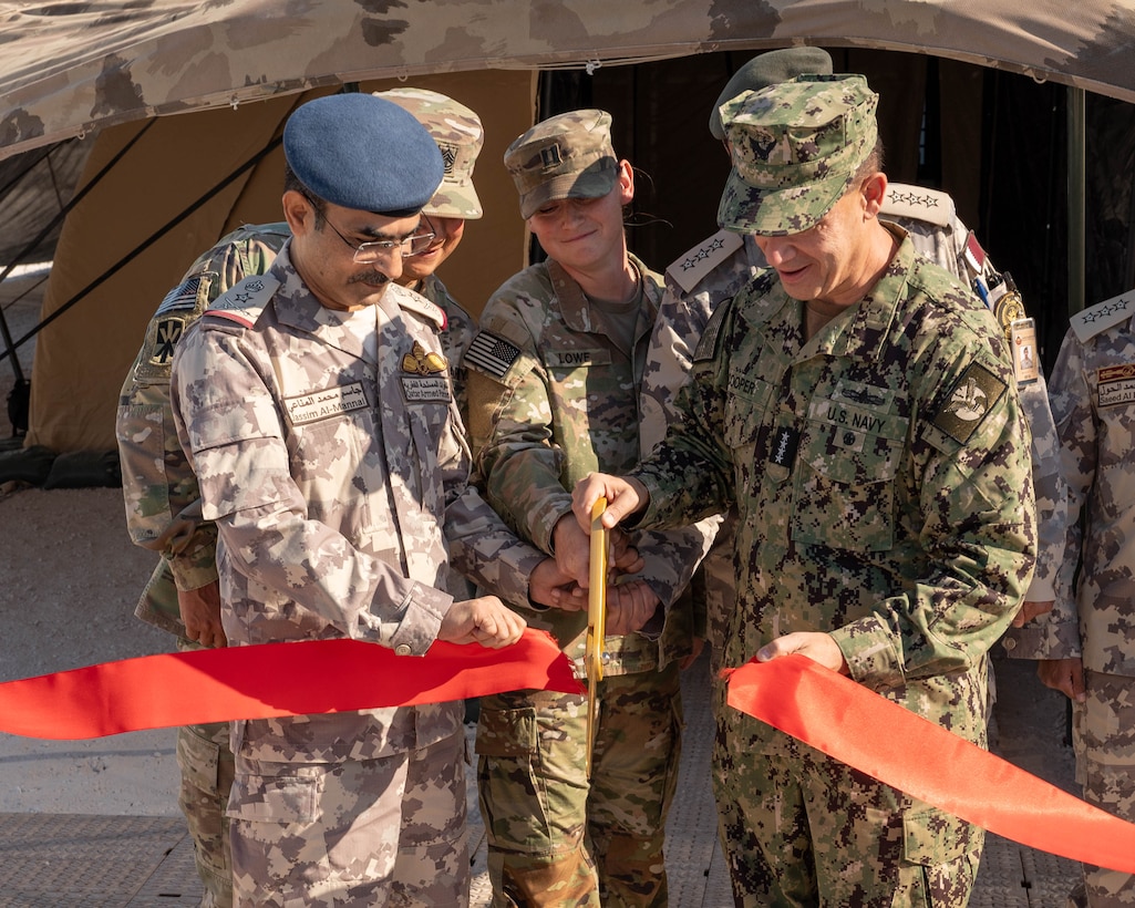 AL UDEID AIR BASE, Qatar (Nov. 3, 2025) Adm. Brad Cooper, commander of U.S. Central Command, right, cuts a ribbon with Chief of Staff of Qatar Armed Forces Lt. Gen. Jassim Al-Mannai during a ceremony at Al Udeid Air Base, Nov. 3. The event marked the opening of a new Combined Command Post for air defense staffed by personnel from Qatar and U.S. forces. (U.S. Air Force photo by Tech. Sgt. Chris Thornbury)