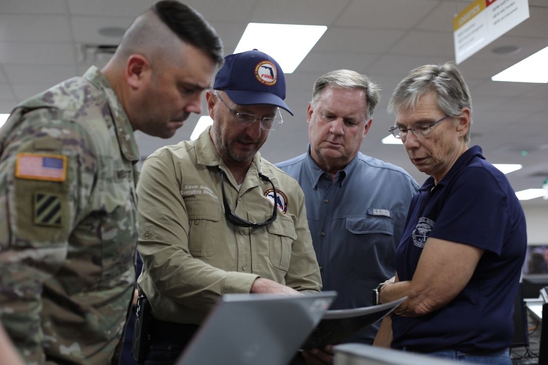 (Left to right) U.S. Army Corps of Engineers (USACE) Jacksonville District Deputy Commander Maj. Matthew Westcott meets with Florida Division of Emergency Management Director Kevin Guthrie, St. Johns River Water Management District Executive Director Michael Register, and Cammie Dewey earlier today at the Lake County Florida Emergency Management Office to talk about a #USACE emergency response mission to address flooding in the surrounding areas. 
The U.S. Army Corps of Engineers (USACE), in coordination with Lake County Emergency Management and state partners, has mobilized personnel and equipment to assist with ongoing flood response efforts in Lake County following recent heavy rainfall across the region.
USACE crews are providing technical assistance under PL 84-99 by providing assessments and recommendations to Lake County for the installation of high-capacity water pumps to help alleviate flooding in affected neighborhoods. The pumps are being strategically placed in coordination with local officials to support water management efforts and protect homes, infrastructure, and public safety.  (U.S. Army Photo by Mark Rankin)