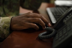 Hands type on a keyboard.