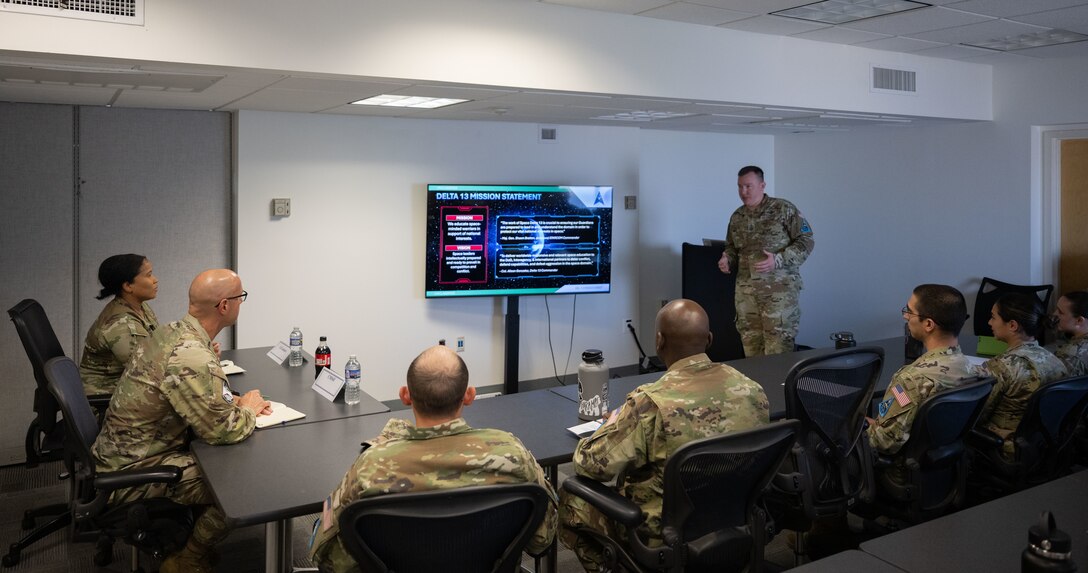 Chief Master Sgt. of the Space Force John Bentivegna receives a Space Delta 13 mission brief at Joint Base Andrews, Maryland.