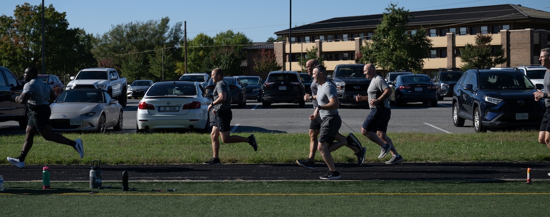 Chief Master Sgt. of the Space Force John Bentivegna and Guardians assigned to Space Delta 13 run at Joint Base Andrews, Maryland.