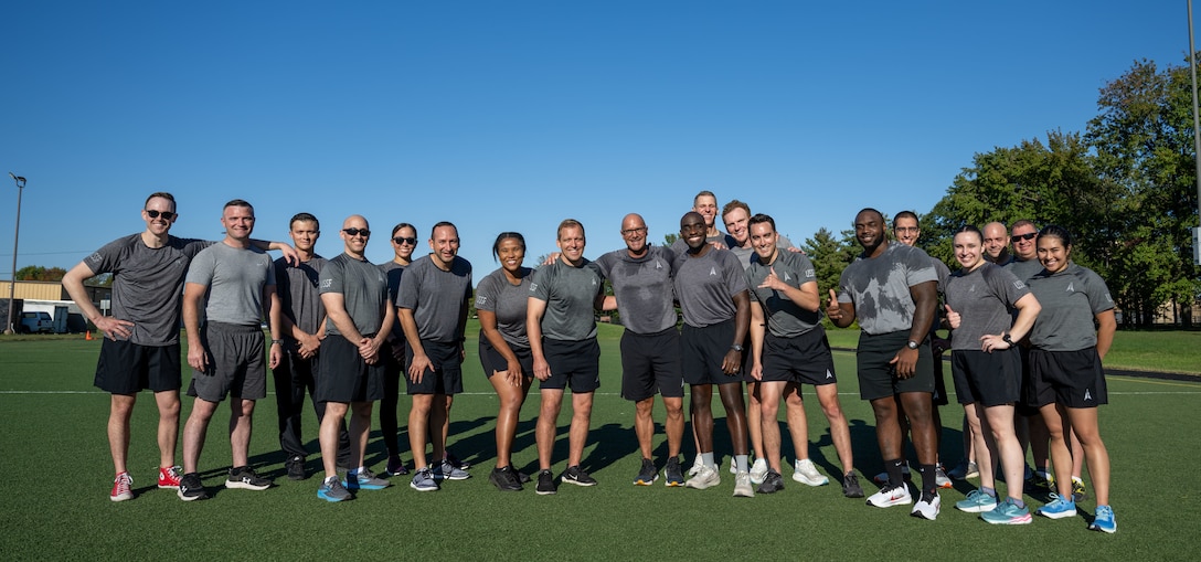 Chief Master Sgt. of the Space Force John Bentivegna and Guardians assigned to Space Delta 13, pose for a photo after a physical training session at Joint Base Andrews, Maryland.