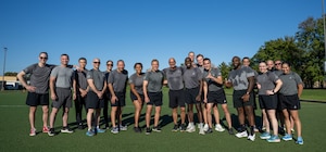 Chief Master Sgt. of the Space Force John Bentivegna and Guardians assigned to Space Delta 13, pose for a photo after a physical training session at Joint Base Andrews, Maryland.