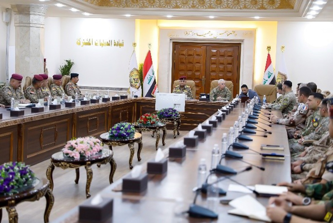 U.S. Army Brig. Gen. Kevin J. Lambert, center-right, commanding general, Combined Joint Task Force – Operation Inherent Resolve (CJTF-OIR), and Iraqi army Lt. Gen. Qais al-Muhammadawi al-Abbasi, deputy director, Joint Operations Center – Iraq, address an assembly during the commencement of the Strike Cell Certification program in Baghdad, Iraq, Sept. 7, 2025. Military Advisory Group, CJTF-OIR facilitated the JOC-I Strike Cell Certification program to enable Iraqi Security Forces to direct the acquisition, targeting, and strike process as ISF takes the lead in efforts to suppress ISIS remnants in Iraq. (U.S. Army photo by Staff Sgt. Zach Mott)