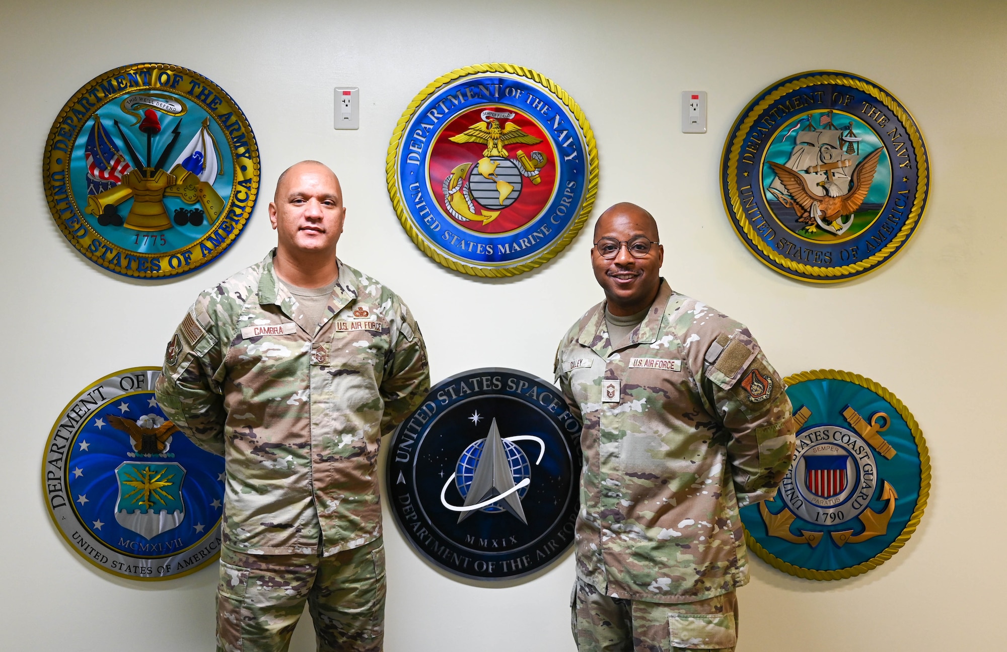 Service members poses for photo.