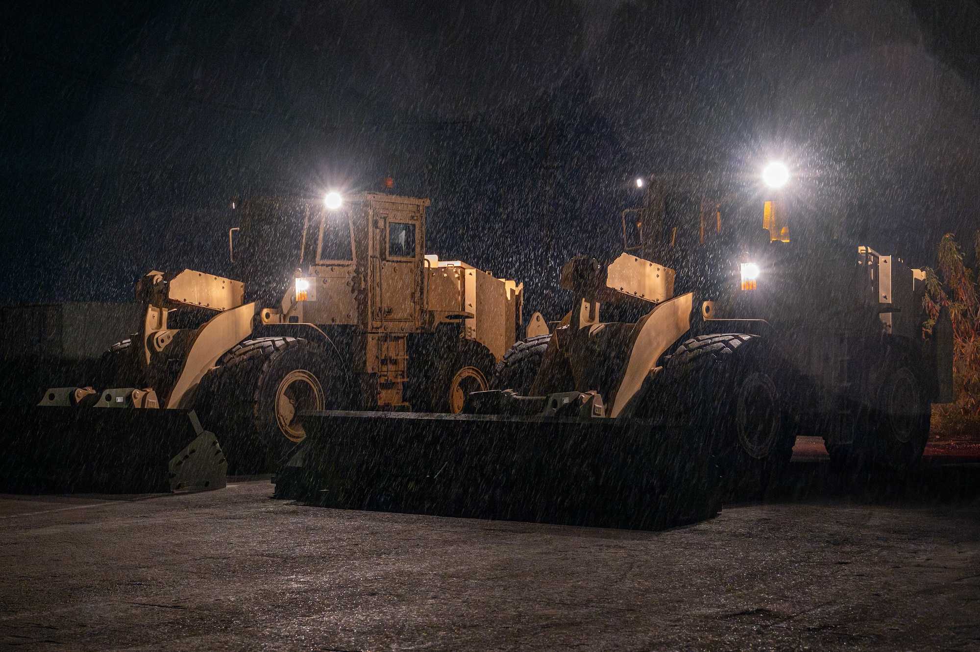 Mass mechanical clearance vehicles operated by 18th Civil Engineer Squadron Airmen clear simulated unexploded submunitions during a mass mechanical clearance exercise in support of BH 26-1 at Kadena Air Base, Japan, Nov. 4, 2025. The vehicle’s reinforced blade protects the operator while displacing or detonating hazards to restore airfield operations. (U.S. Air Force photo by Airman Nathaniel Jackson)