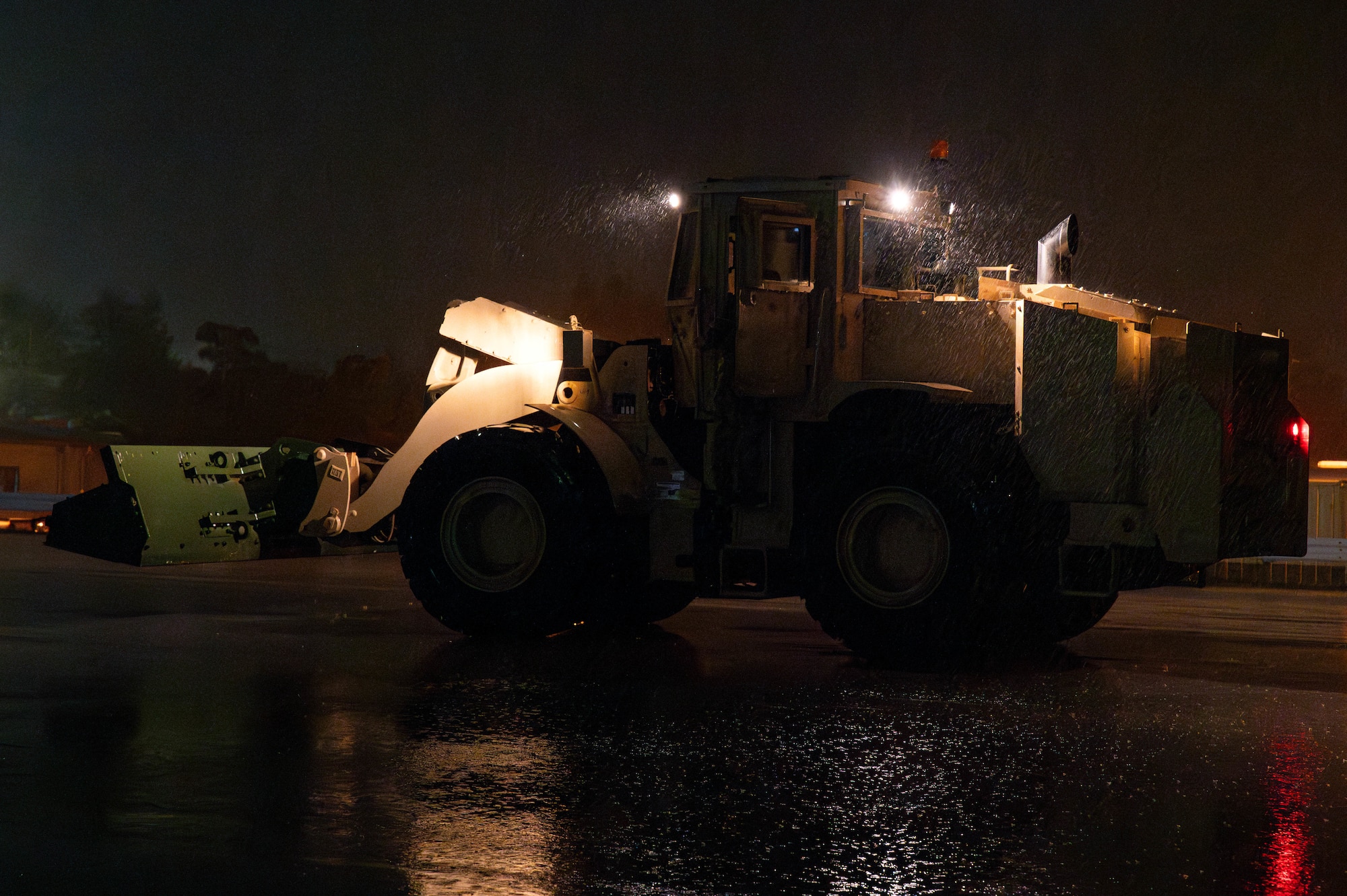 A Mass mechanical clearance vehicle operated by 18th Civil Engineer Squadron Airmen clears simulated unexploded submunitions during a mass mechanical clearance exercise in support of BH 26-1 at Kadena Air Base, Japan, Nov. 4, 2025.  The training prepared Airmen to respond rapidly and safely to restore mission capability after an attack. (U.S. Air Force photo by Airman Nathaniel Jackson)
