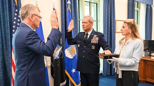 Secretary of the Air Force Troy Meink, left, swears in Gen. Ken Wilsbach as the new Chief of Staff of the Air Force at the Pentagon, Arlington, Virginia, Nov. 3, 2025. Mrs. Cindy Wilsbach joined her husband during the ceremony. (U.S. Air Force photo by Staff Sgt. Stuart Bright)