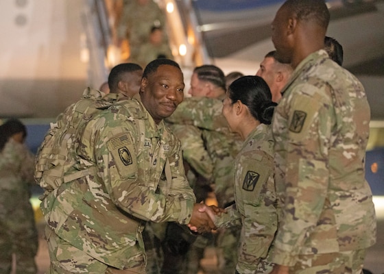 Soldiers of 2nd Battalion, 1st Air Defense Artillery Regiment, 35th Air Defense Artillery Brigade are greeted by Eighth Army and 35th ADA leaders as they deplane at Osan Air Base, South Korea, Oct. 30, 2025. The 2-1 ADA Battalion departed the Korean peninsula in March on short-notice orders to provide critical air and missile defense for key U.S. and coalition assets in the U.S. Central Command area of responsibility.