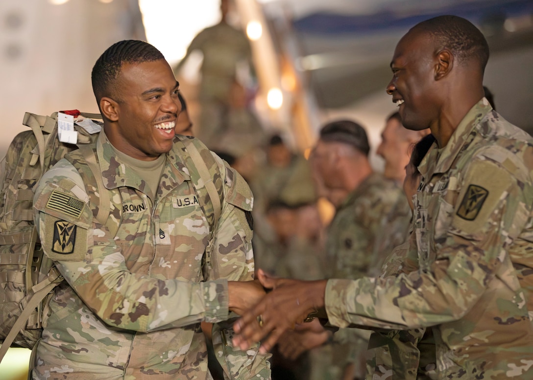 Soldiers of 2nd Battalion, 1st Air Defense Artillery Regiment, 35th Air Defense Artillery Brigade are greeted by Eighth Army and 35th ADA leaders as they deplane at Osan Air Base, South Korea, Oct. 30, 2025. The 2-1 ADA Battalion departed the Korean peninsula in March on short-notice orders to provide critical air and missile defense for key U.S. and coalition assets in the U.S. Central Command area of responsibility.