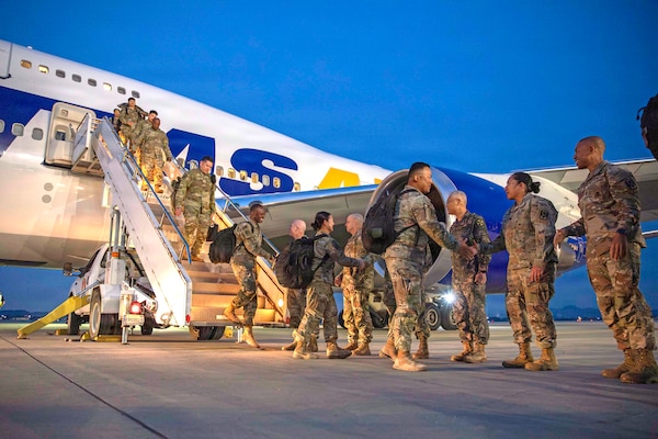 Soldiers of 2nd Battalion, 1st Air Defense Artillery Regiment, 35th Air Defense Artillery Brigade are greeted by Eighth Army and 35th ADA leaders as they deplane at Osan Air Base, South Korea, Oct. 30, 2025. The 2-1 ADA Battalion departed the Korean peninsula in March on short-notice orders to provide critical air and missile defense for key U.S. and coalition assets in the U.S. Central Command area of responsibility.